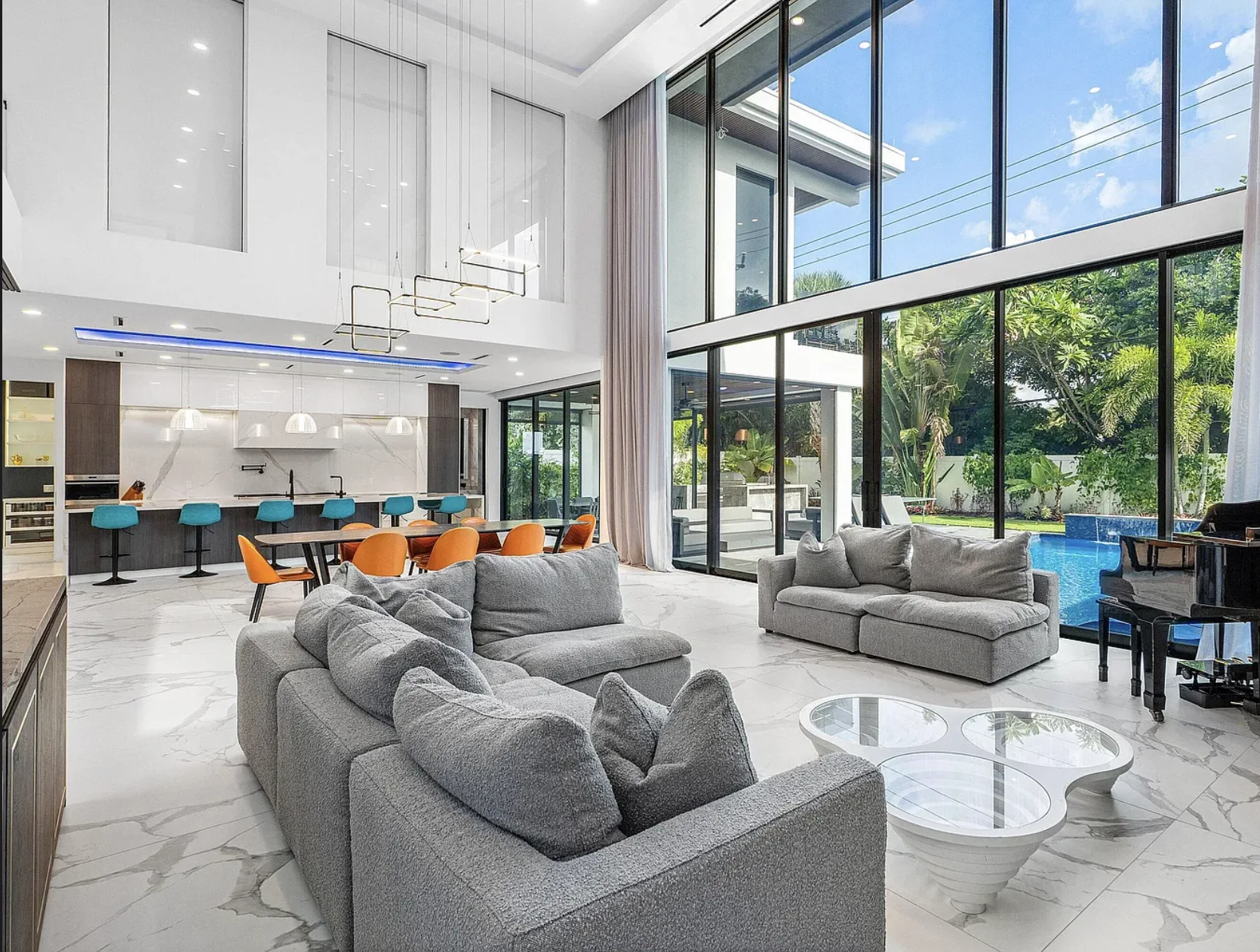 Open living room with pool view